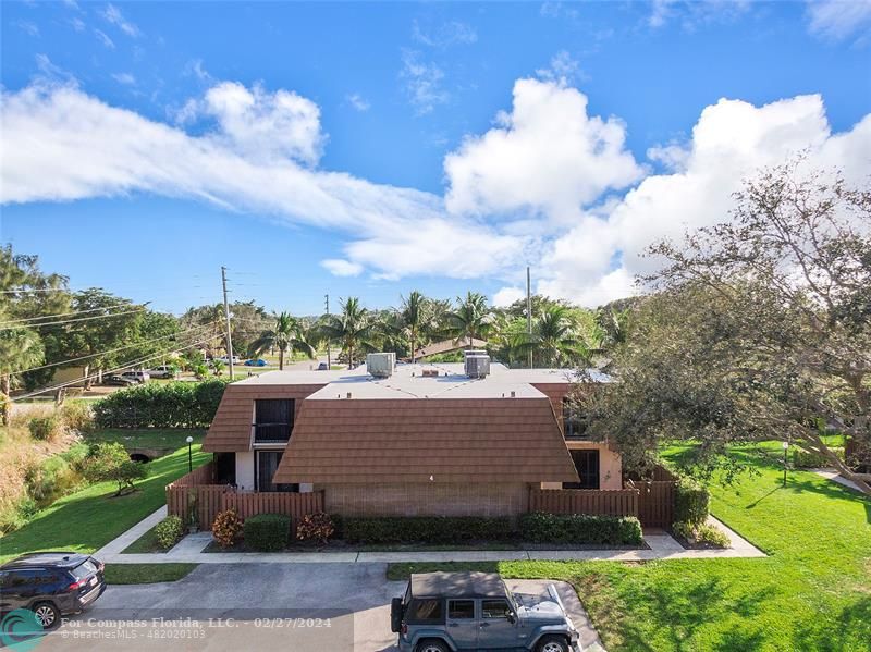 825 Center Street Jupiter, FL 33458 - Photo 30 of 37 a view of a yard in front of the house