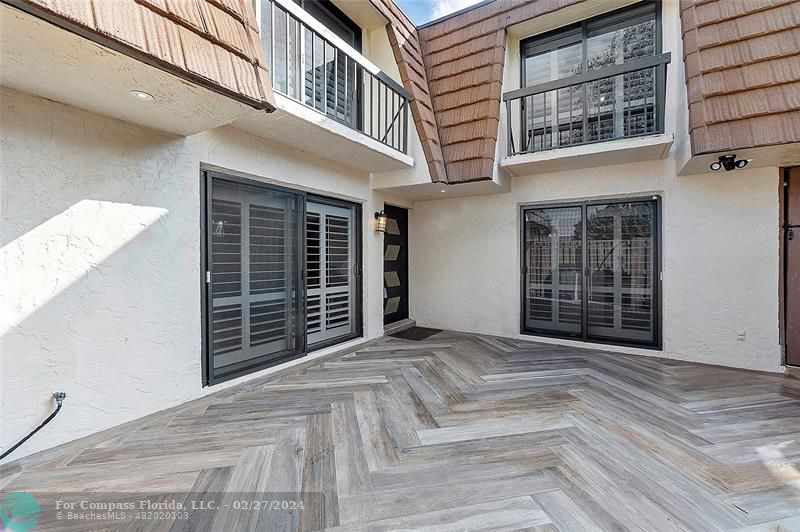 825 Center Street Jupiter, FL 33458 - Photo 3 of 37 a view of a house with large windows