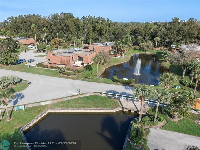 825 Center Street Jupiter, FL 33458 - Photo 31 of 37 a view of a swimming pool with a yard