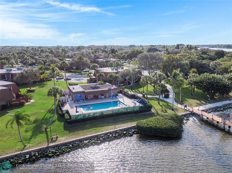 825 Center Street Jupiter, FL 33458 - Photo 32 of 37 a view of a lake with a car parked