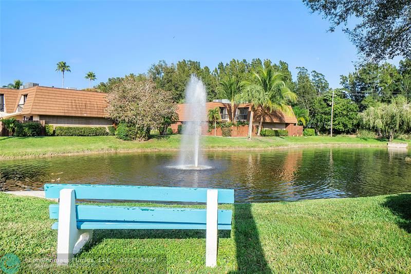 825 Center Street Jupiter, FL 33458 - Photo 33 of 37 a view of a lake with a building in the background
