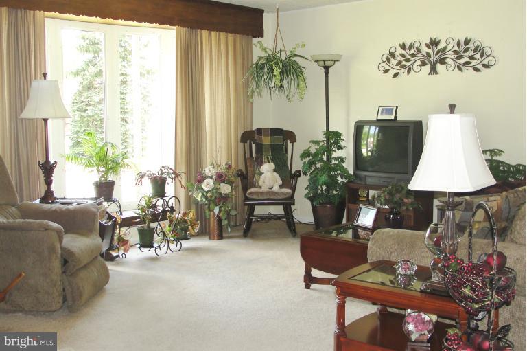 1820 Willann Road Rosedale, MD 21237 - Photo 1 of 27 a living room with furniture and a large window