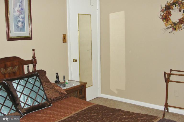 1820 Willann Road Rosedale, MD 21237 - Photo 15 of 27 a bedroom with a bed and a window