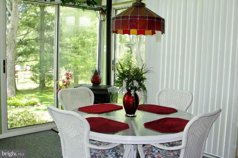 1820 Willann Road Rosedale, MD 21237 - Photo 20 of 27 a view of a dining room with furniture window and outside view