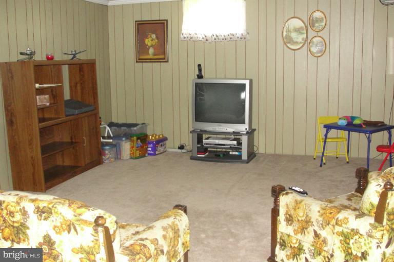 1820 Willann Road Rosedale, MD 21237 - Photo 4 of 27 a living room with furniture and a flat screen tv
