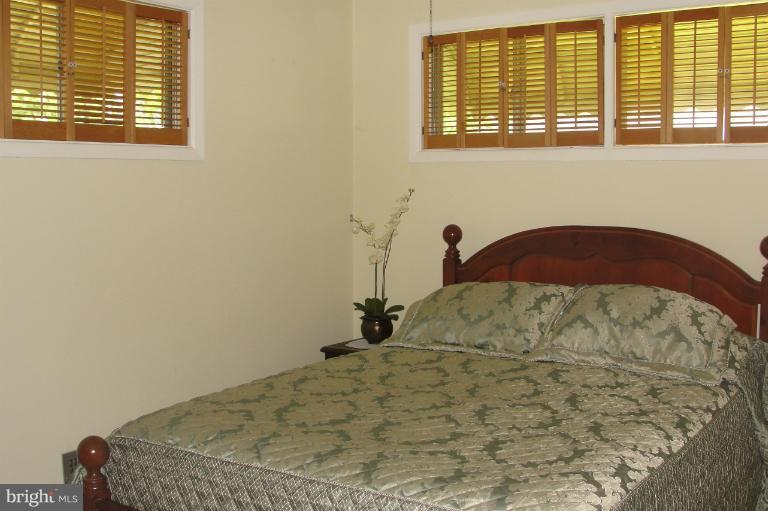 1820 Willann Road Rosedale, MD 21237 - Photo 9 of 27 a bedroom with a bed and a window