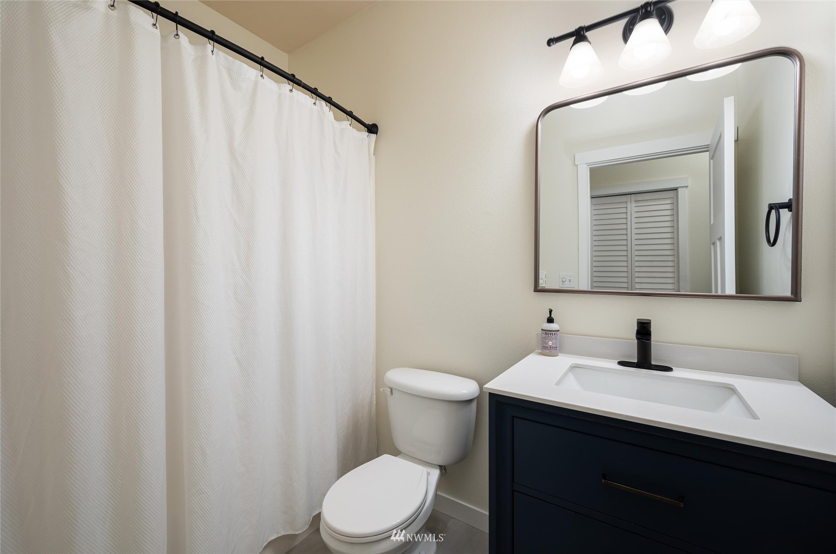 1305 Boon Street, Unit 122 Sumas, WA 98295 - Photo 11 of 21 a bathroom with a sink a toilet and mirror