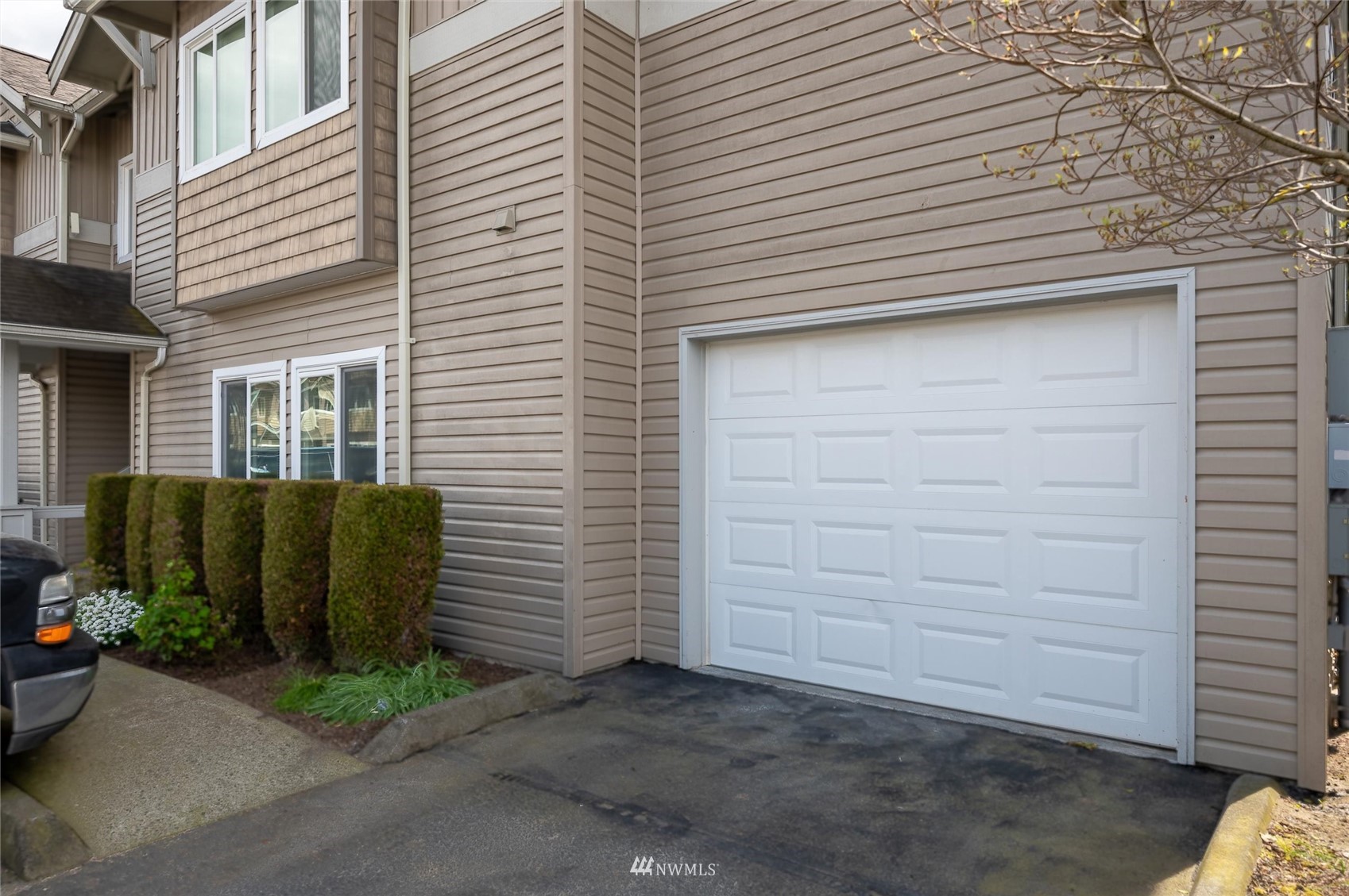 1305 Boon Street, Unit 122 Sumas, WA 98295 - Photo 19 of 21 a view of a house with a garage
