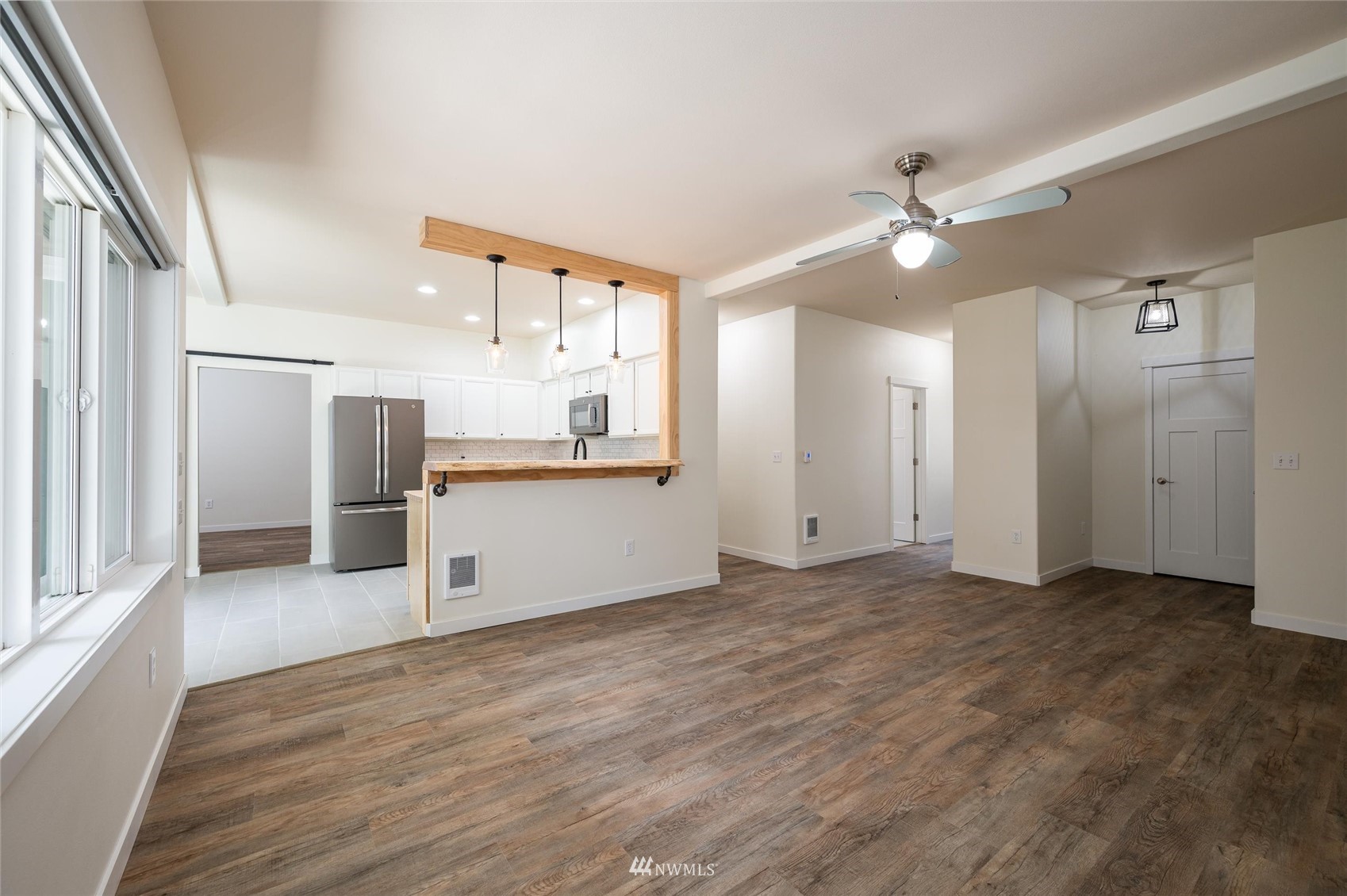 1305 Boon Street, Unit 122 Sumas, WA 98295 - Photo 6 of 21 a view of a kitchen with a sink and a refrigerator