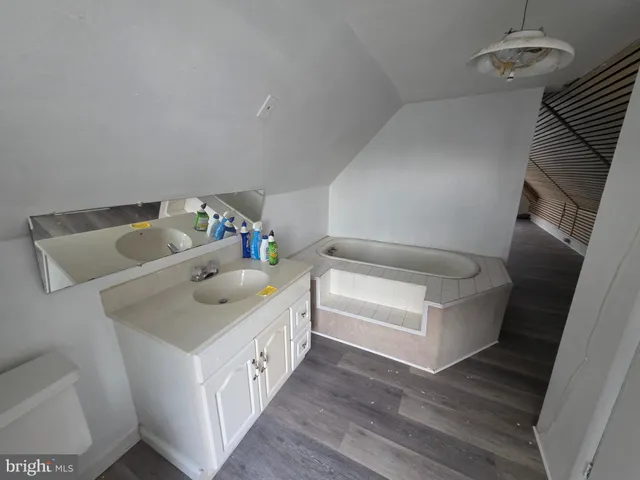 a bathroom with a sink and mirror