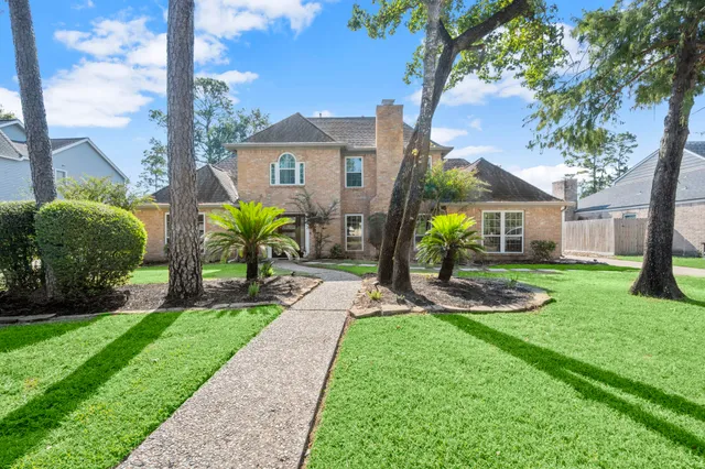 a view of a chair and table in the garden