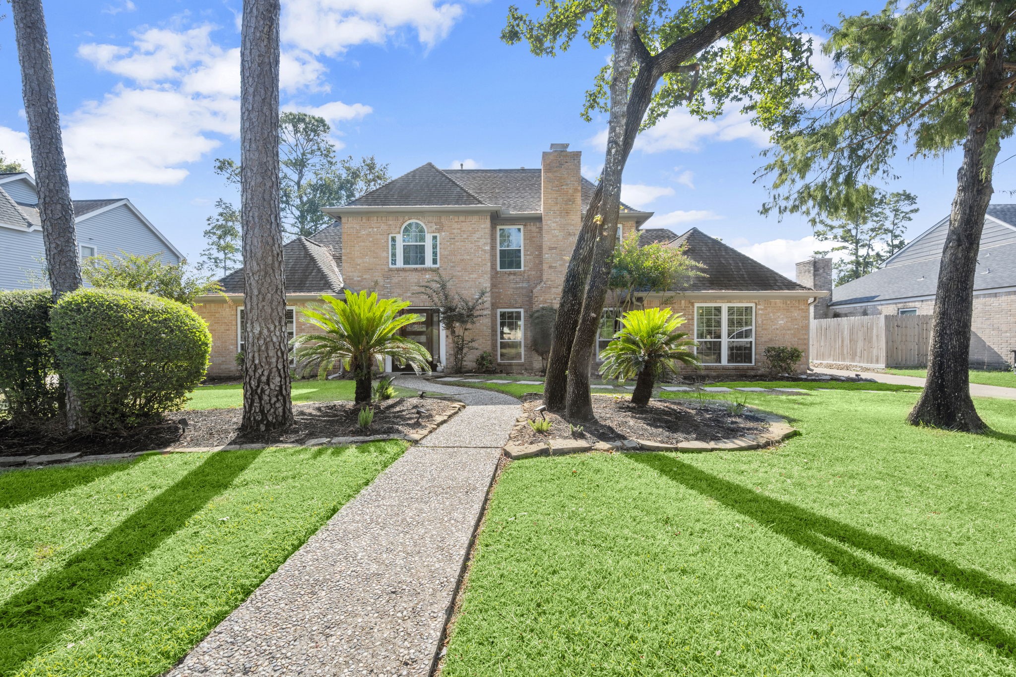 a view of a chair and table in the garden