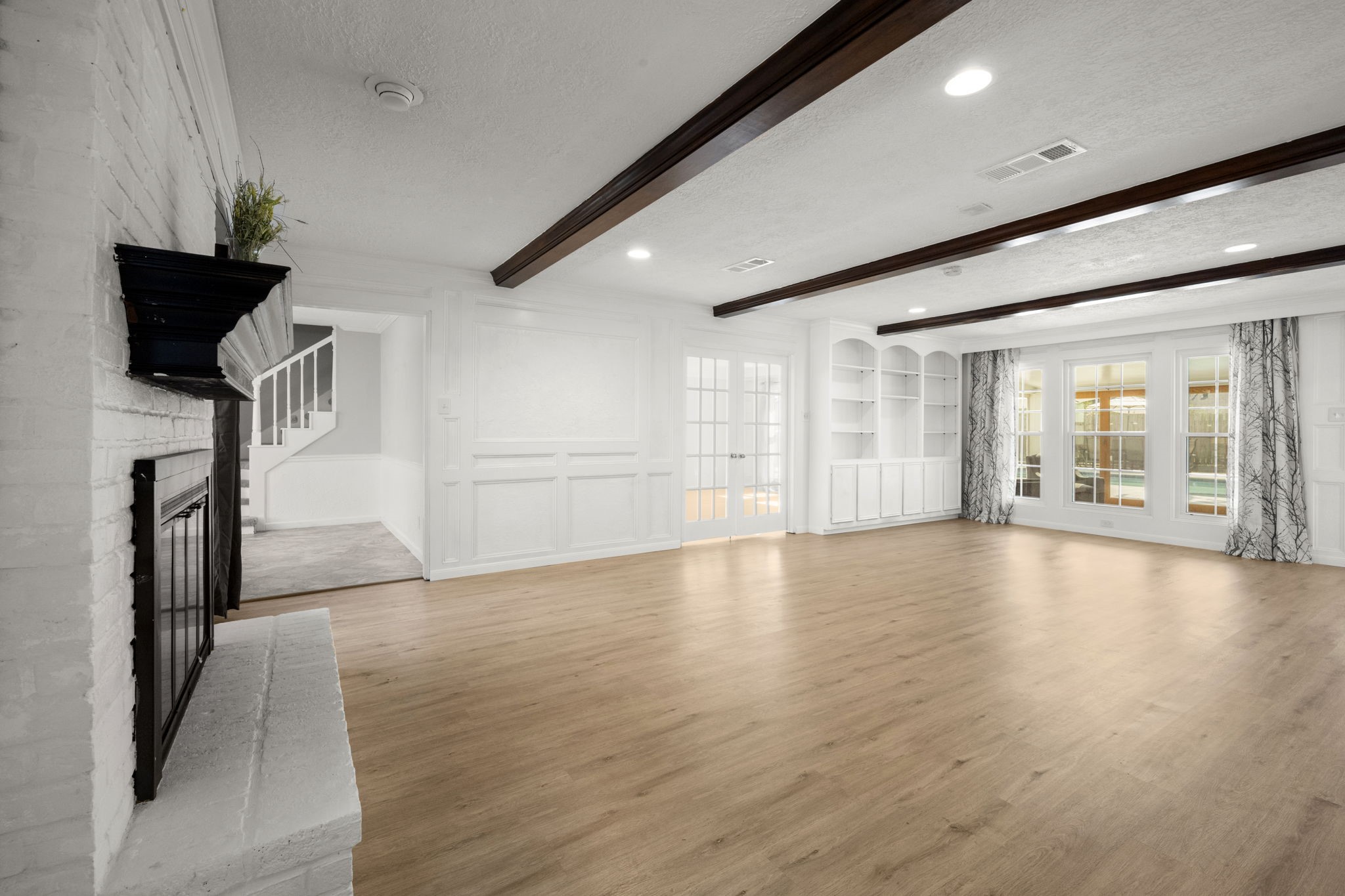 6607 Saffron Hills Drive Spring, TX 77379 - Photo 11 of 48 a view of empty room with wooden floor and fan