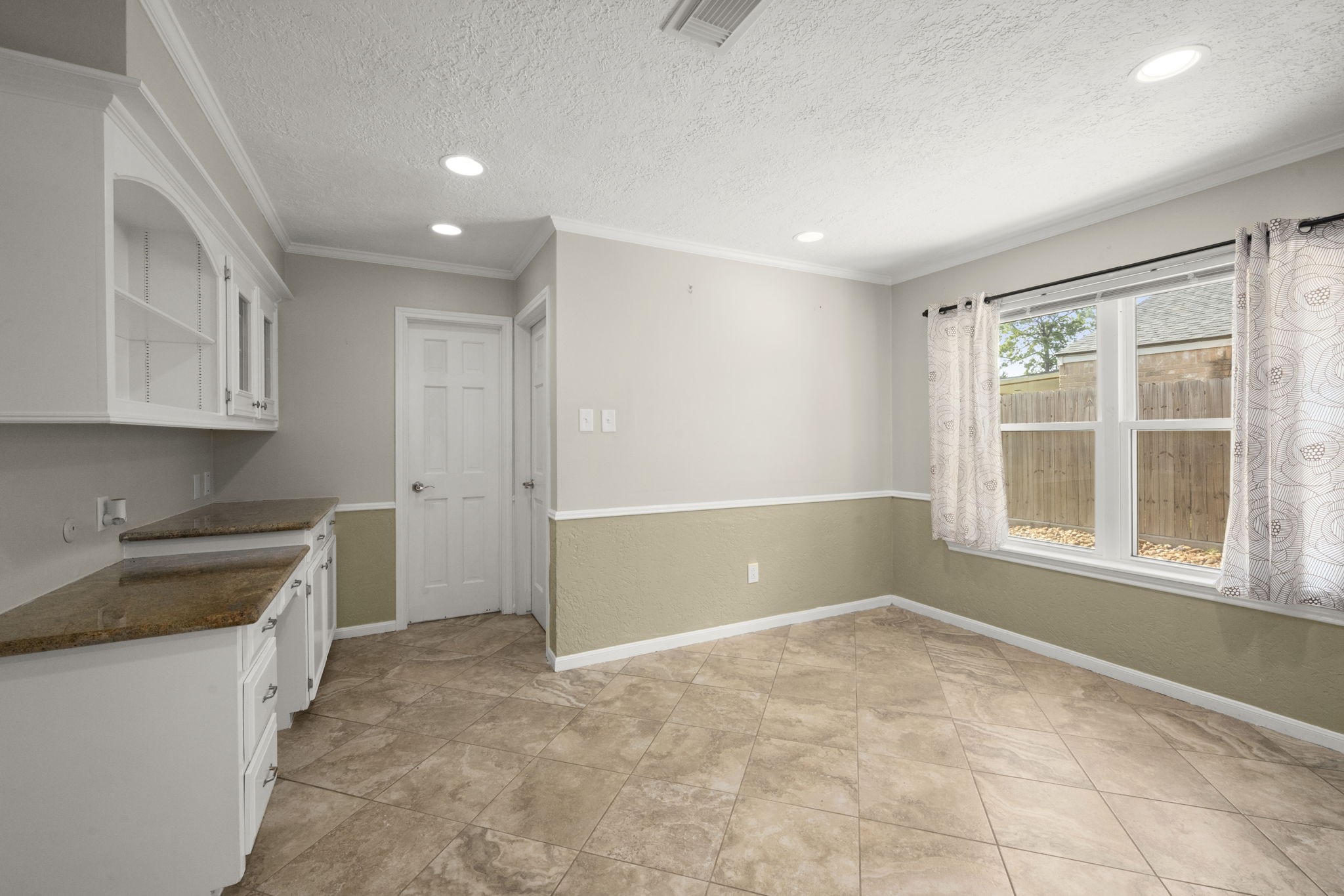 6607 Saffron Hills Drive Spring, TX 77379 - Photo 14 of 48 a view of an empty room with a window