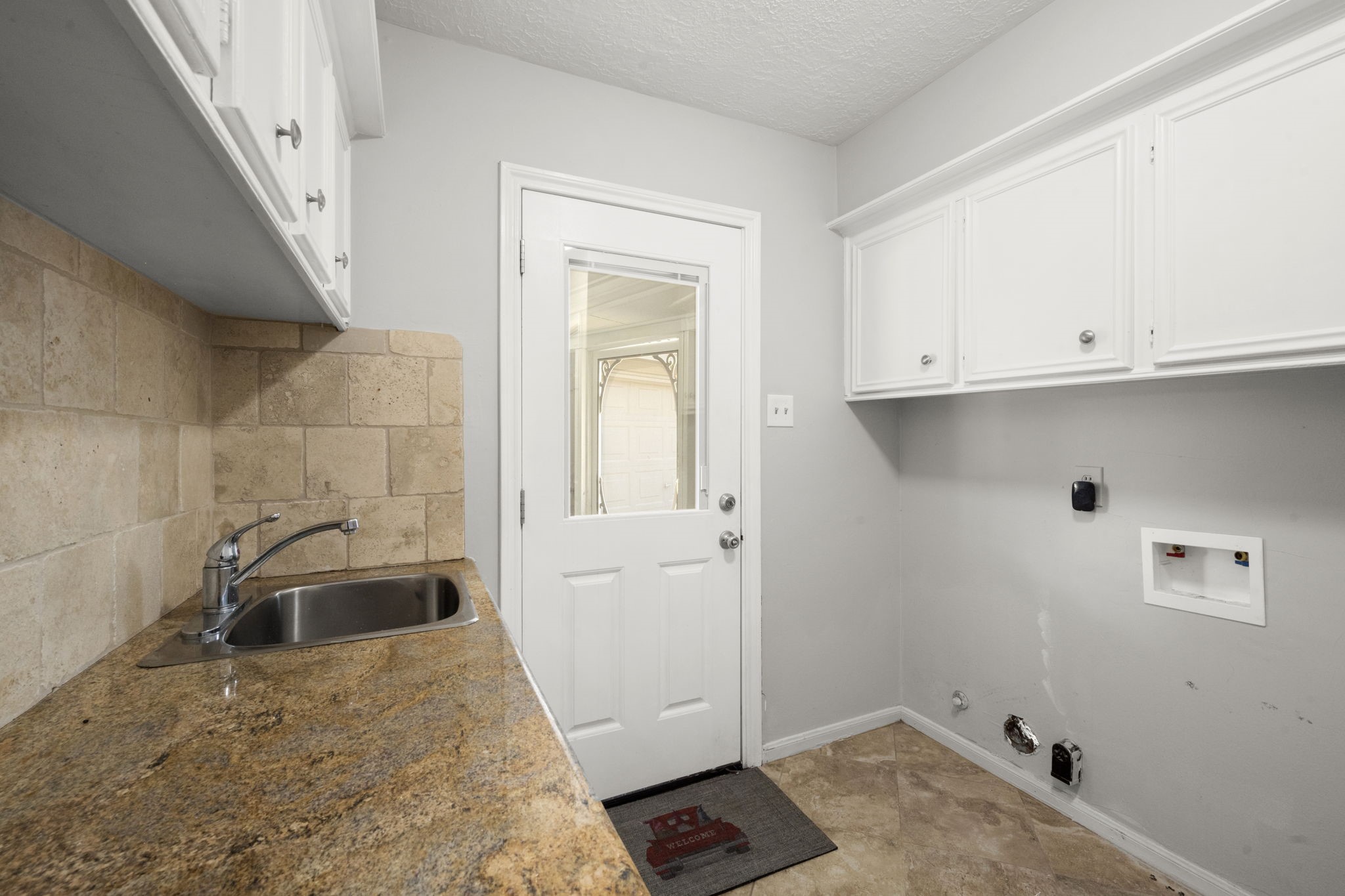 6607 Saffron Hills Drive Spring, TX 77379 - Photo 17 of 48 a bathroom with a sink and cabinets