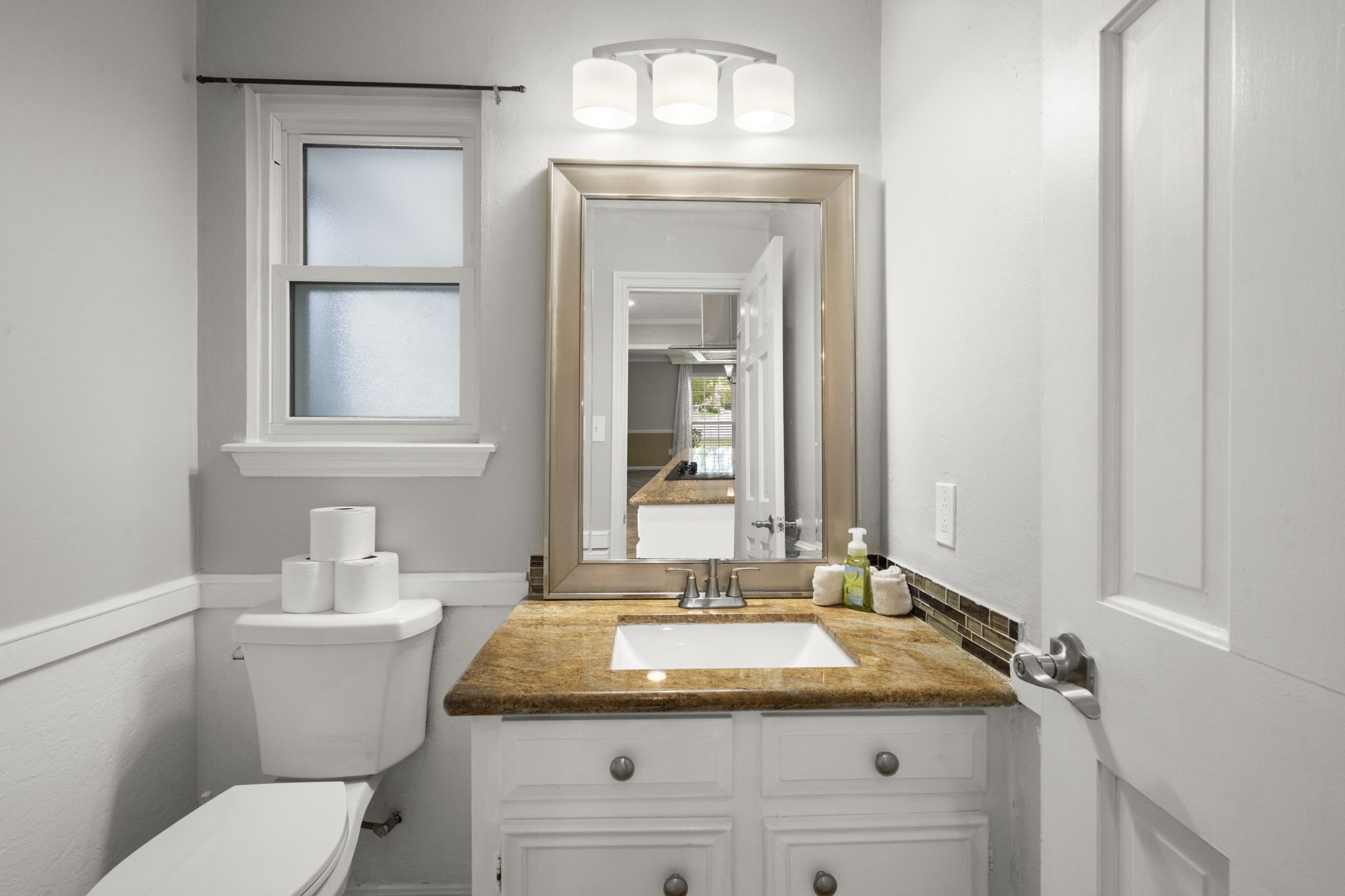 6607 Saffron Hills Drive Spring, TX 77379 - Photo 18 of 48 a bathroom with a granite countertop sink and a mirror