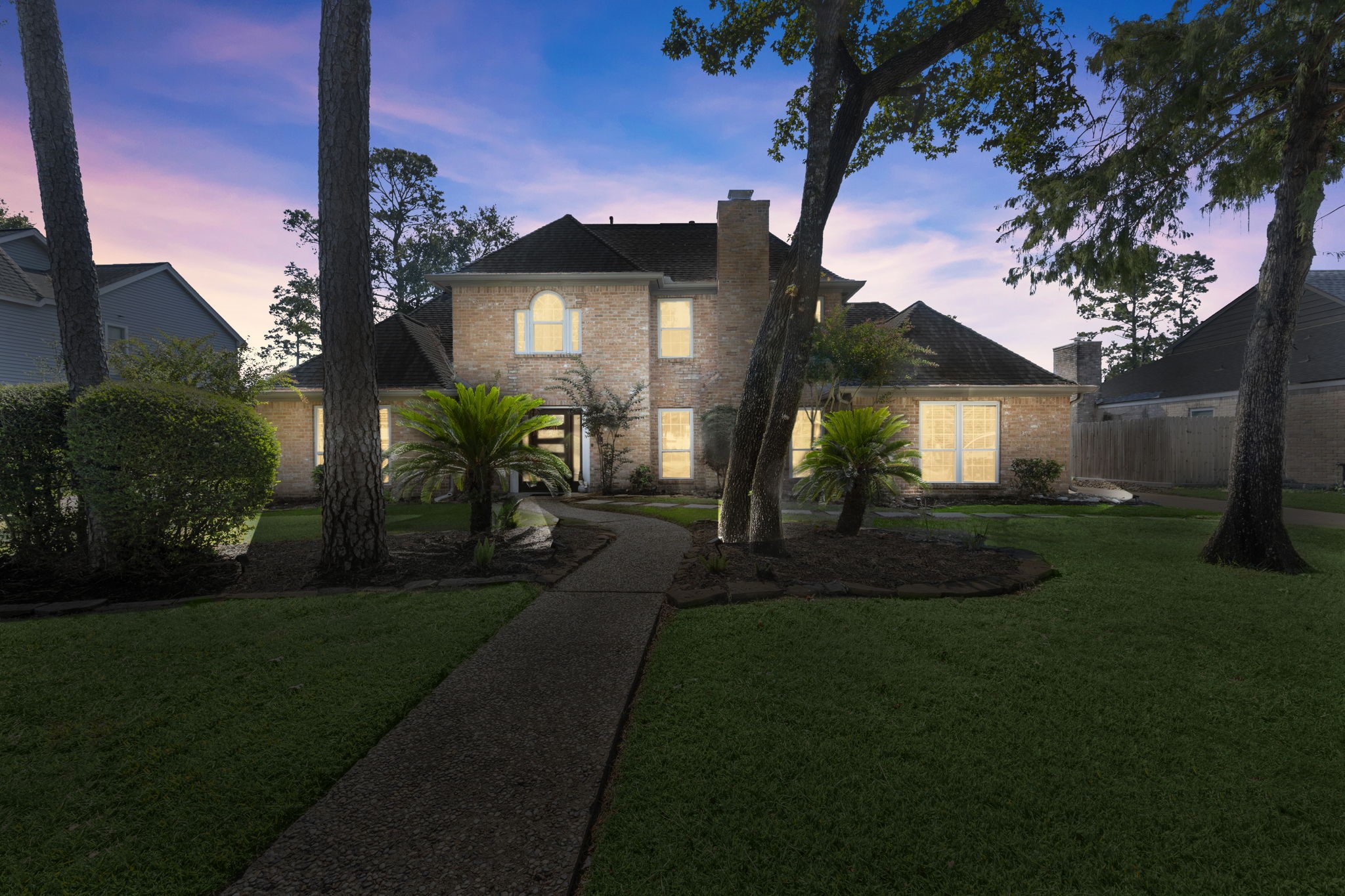 6607 Saffron Hills Drive Spring, TX 77379 - Photo 2 of 48 a front view of a house with garden