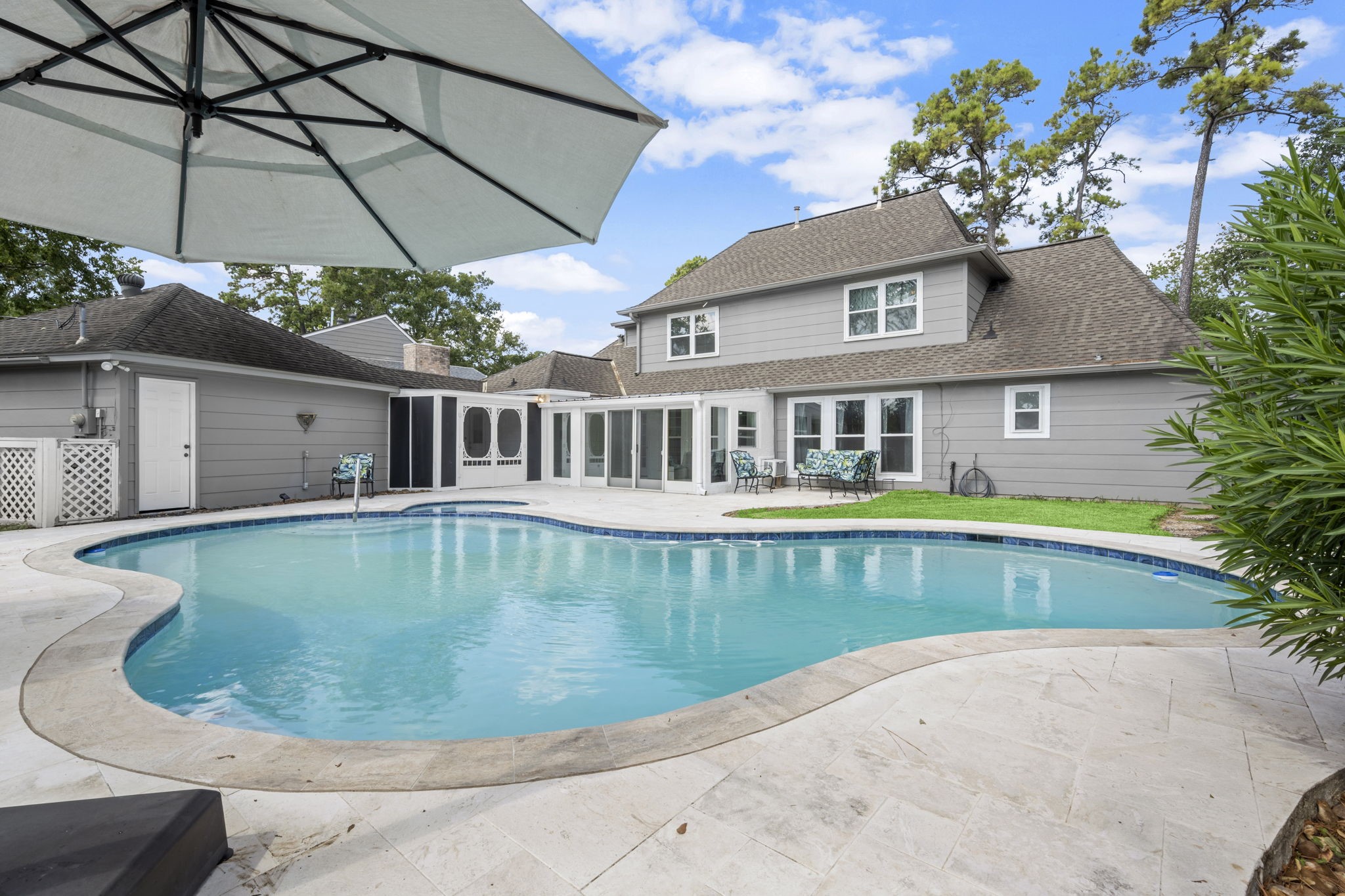 6607 Saffron Hills Drive Spring, TX 77379 - Photo 40 of 48 a view of a house with a swimming pool