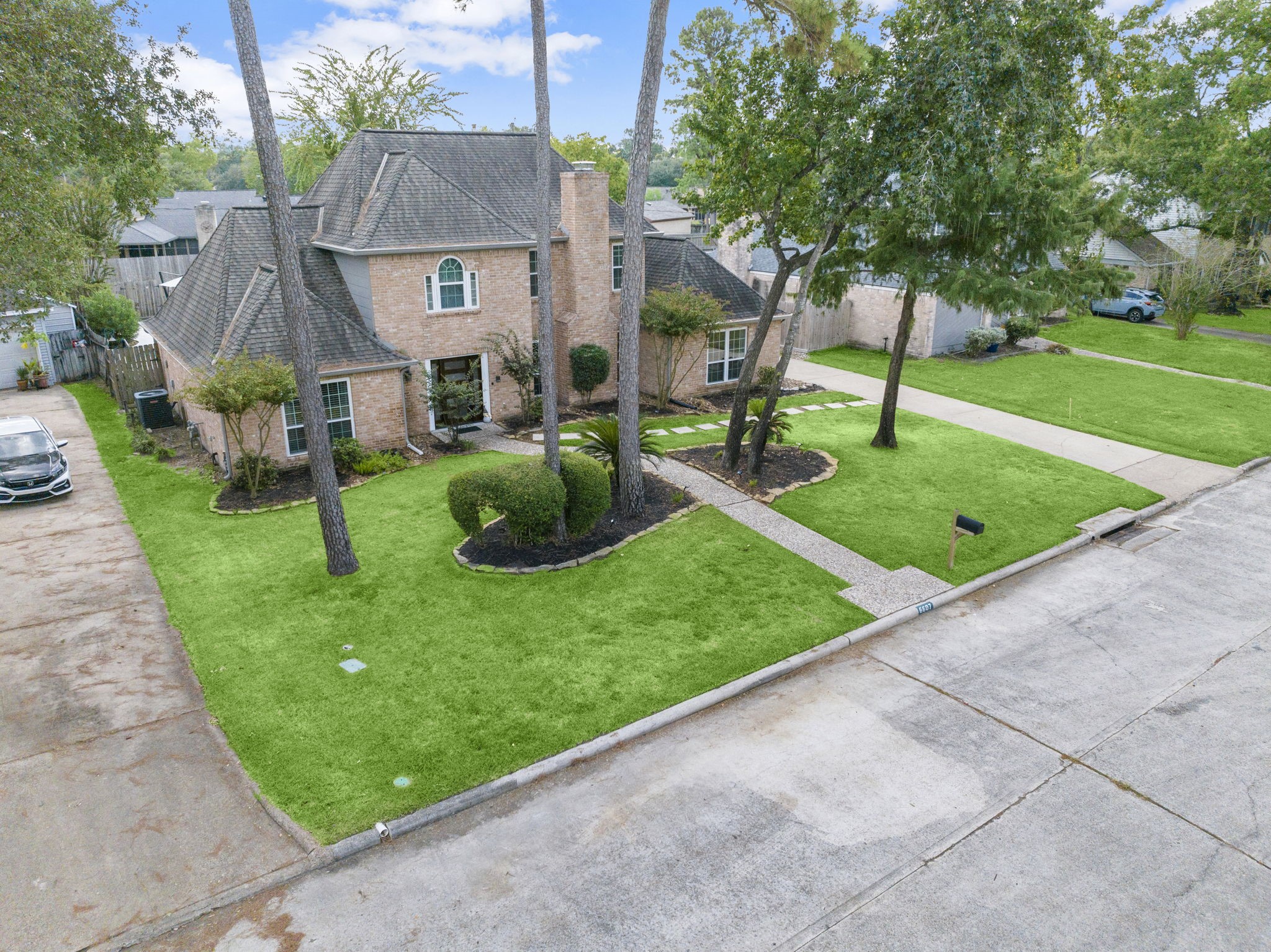 6607 Saffron Hills Drive Spring, TX 77379 - Photo 4 of 48 Lush landscaping in established Wimbledon Estates.