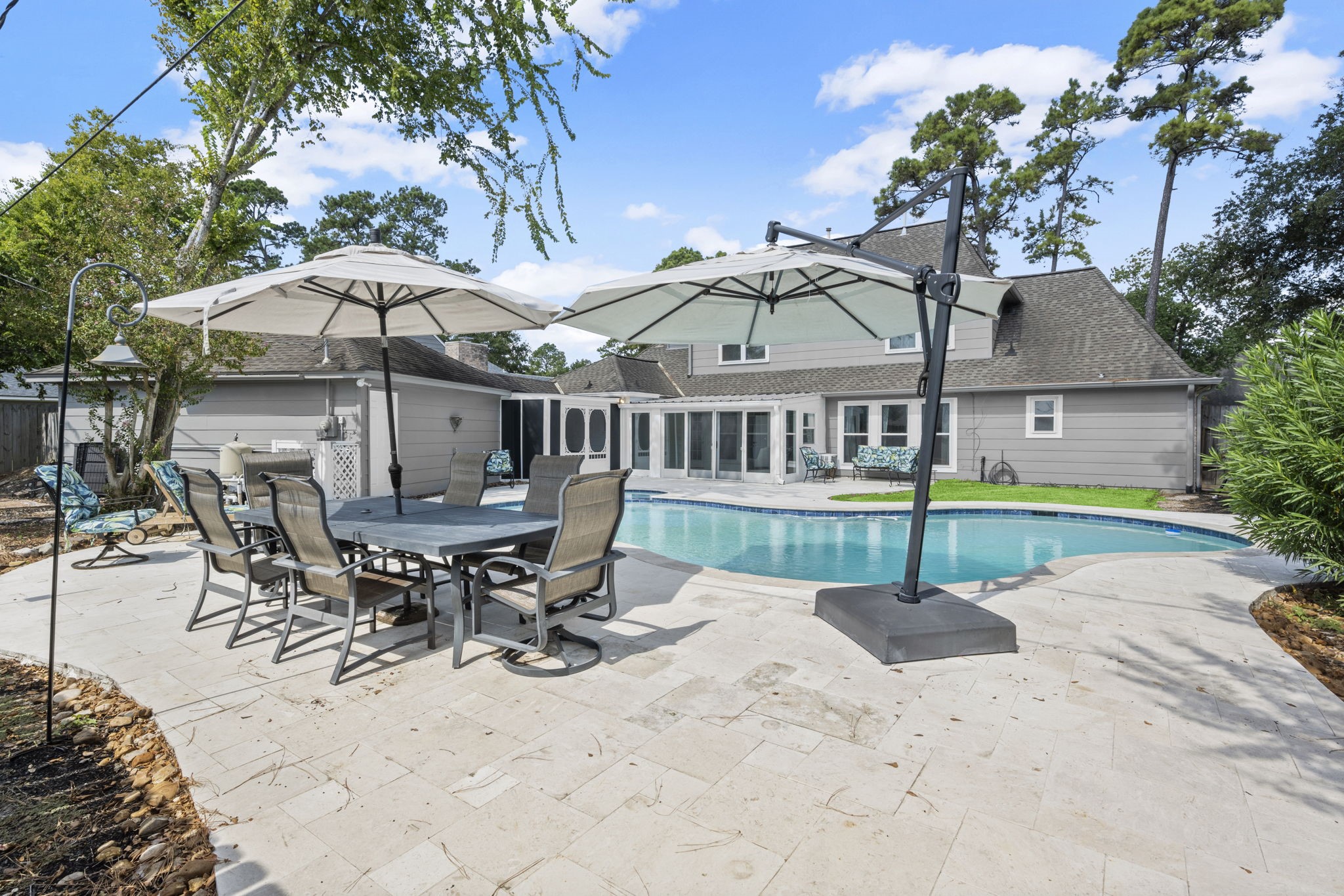 6607 Saffron Hills Drive Spring, TX 77379 - Photo 41 of 48 a view of a house with backyard and furniture