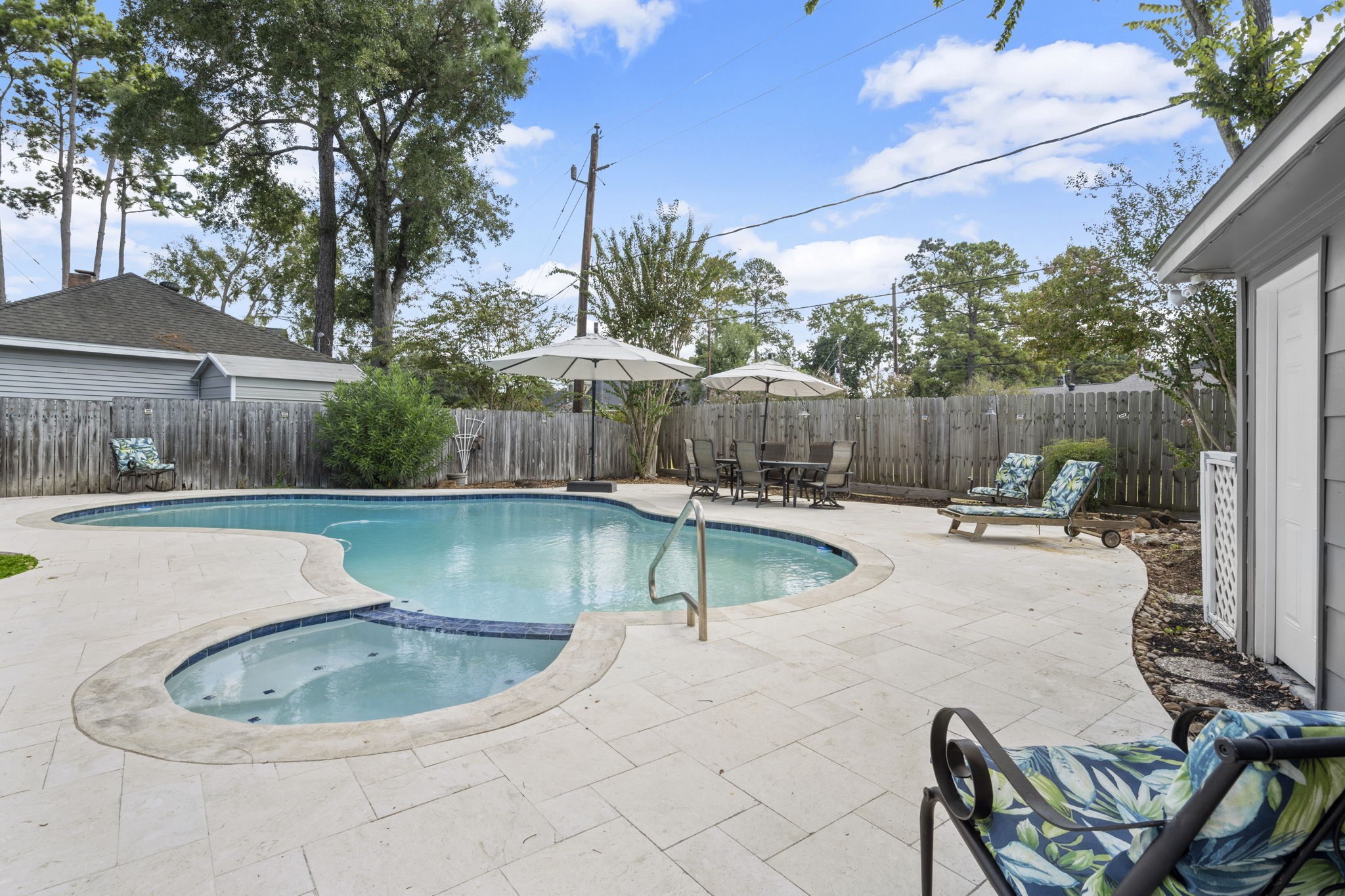 6607 Saffron Hills Drive Spring, TX 77379 - Photo 42 of 48 a view of a swimming pool with a patio