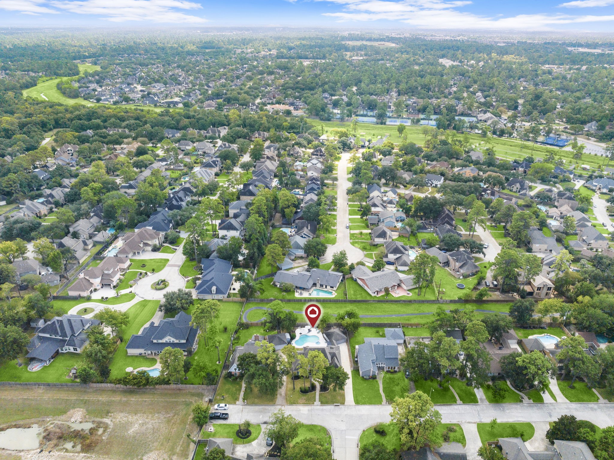 6607 Saffron Hills Drive Spring, TX 77379 - Photo 44 of 48 an aerial view of residential houses with outdoor space and trees