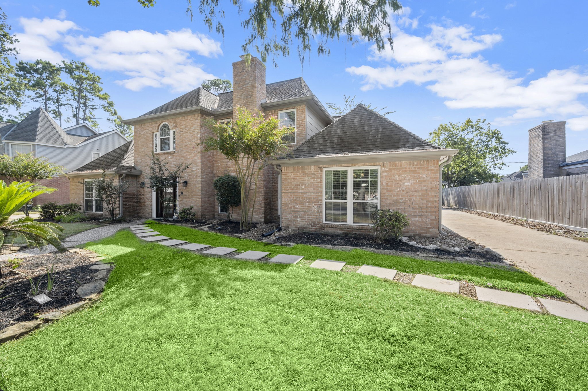 6607 Saffron Hills Drive Spring, TX 77379 - Photo 7 of 48 a front view of a house with a yard and garage