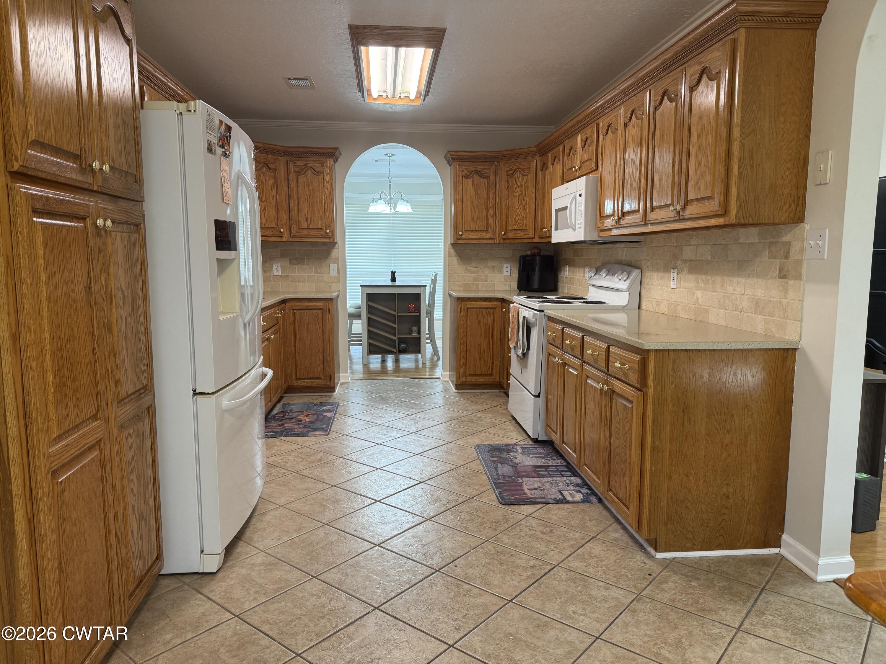 126 Waldunn Cove Rutherford, TN 38369 - Photo 2 of 18 a kitchen with stainless steel appliances granite countertop a refrigerator and a stove