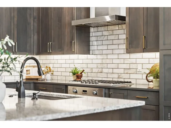 a sink with granite countertop a sink and a stove