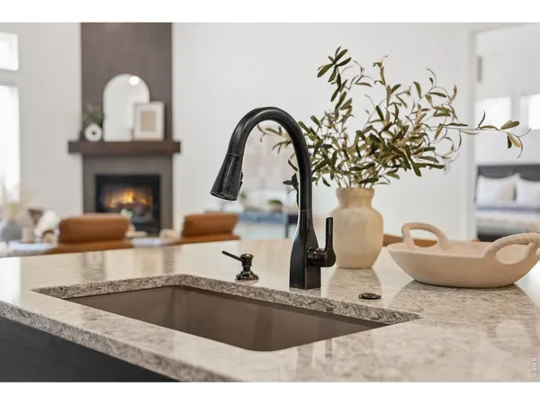a kitchen with a sink and a stove