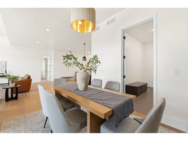 a dining room with a table and chairs