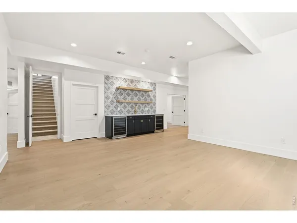 a view of empty room with a fireplace