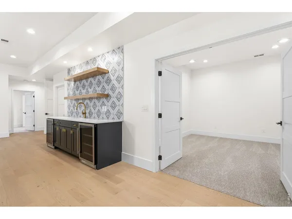 a view of an empty room with a cabinet