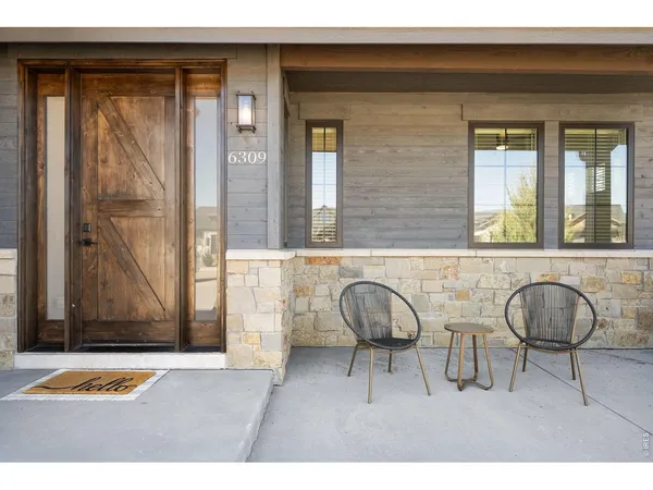 a backyard of a house with seating space