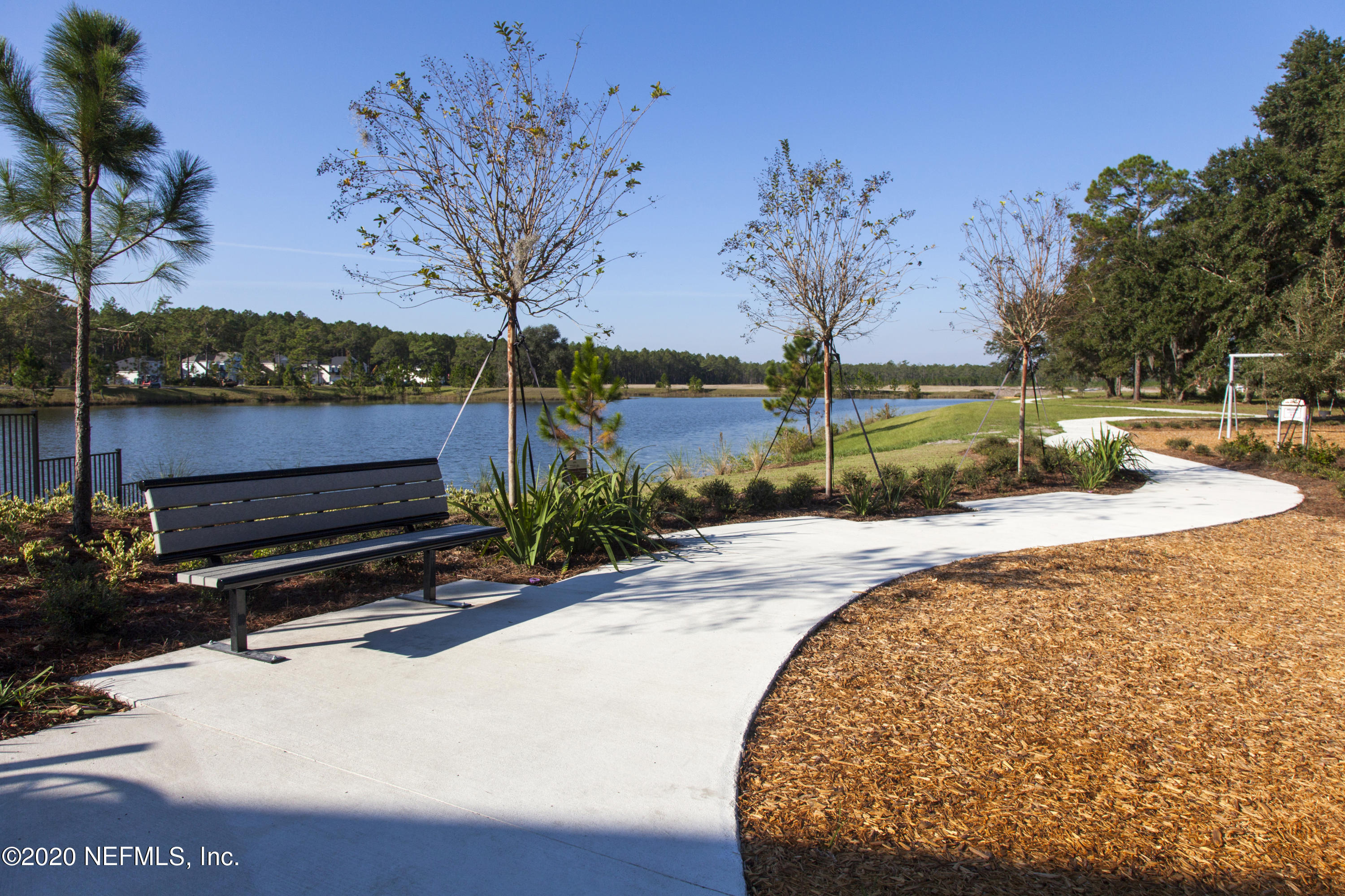 933 Rustic Mill Dr Street St. Augustine, FL 32092 - Photo 27 of 29 a view of backyard with swimming pool and outdoor seating