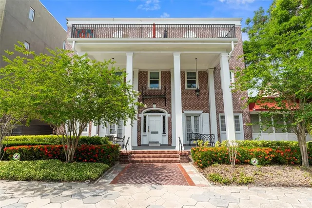 a view of a building with potted plants