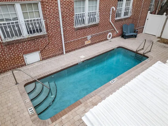 a view of a backyard with sitting area