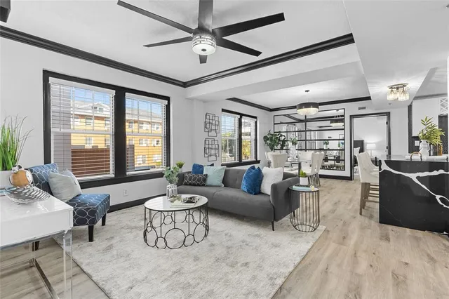 a living room with furniture and a large window