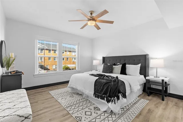 a bedroom with a large bed and a window