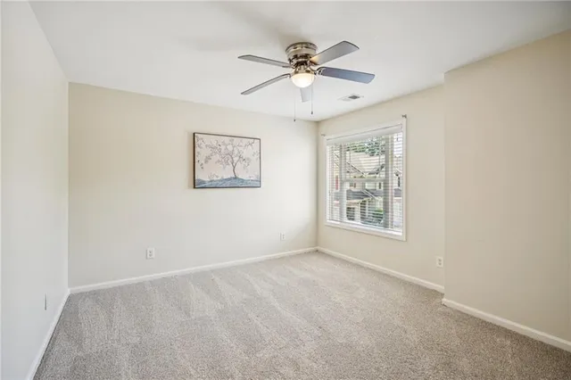 a view of a bedroom with washer and dryer
