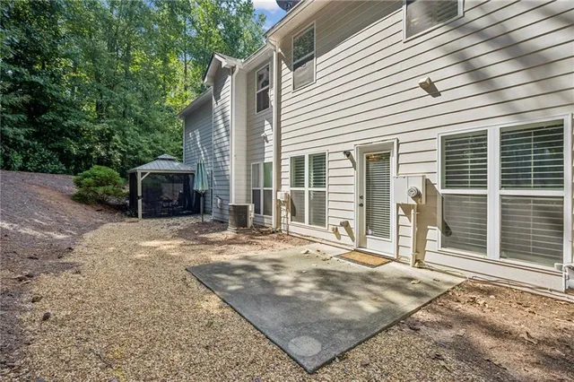 a view of a city with lush green forest