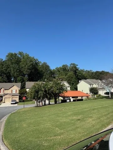 a view of outdoor space with garden and trees