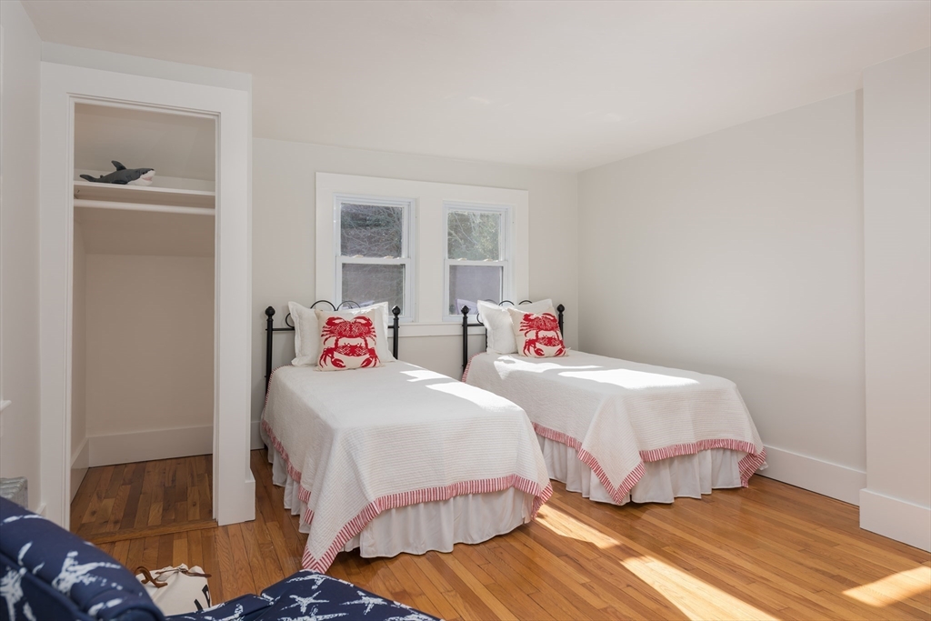 546 Wakeby Road Barnstable, MA 02648 - Photo 23 of 29 a bedroom with two beds and a window