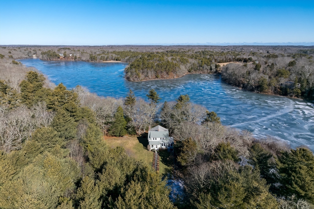 546 Wakeby Road Barnstable, MA 02648 - Photo 29 of 29 a view of a lake with beach and mountain view