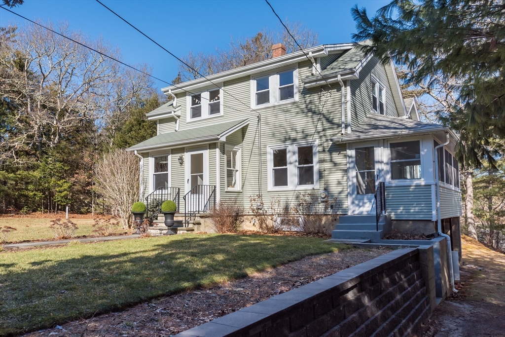 546 Wakeby Road Barnstable, MA 02648 - Photo 8 of 29 a front view of a house with garden
