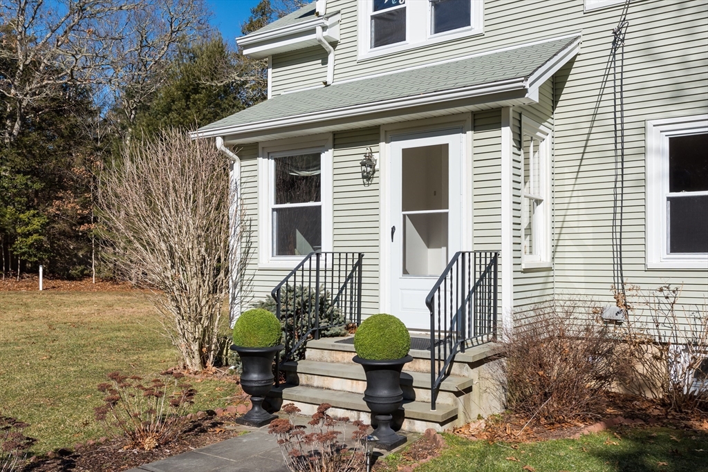 546 Wakeby Road Barnstable, MA 02648 - Photo 9 of 29 a view of a two chairs in the back yard