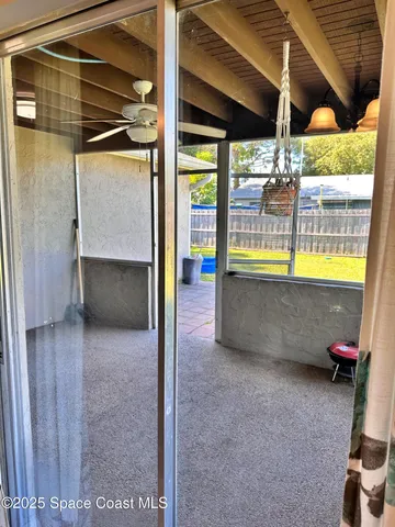 a view of an empty room with a balcony