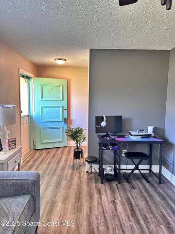 a workspace with furniture and wooden floor