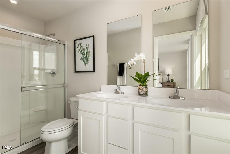 4160 Dragonfly Road Bailey, NC 27807 - Photo 5 of 5 a bathroom with a sink toilet and a mirror