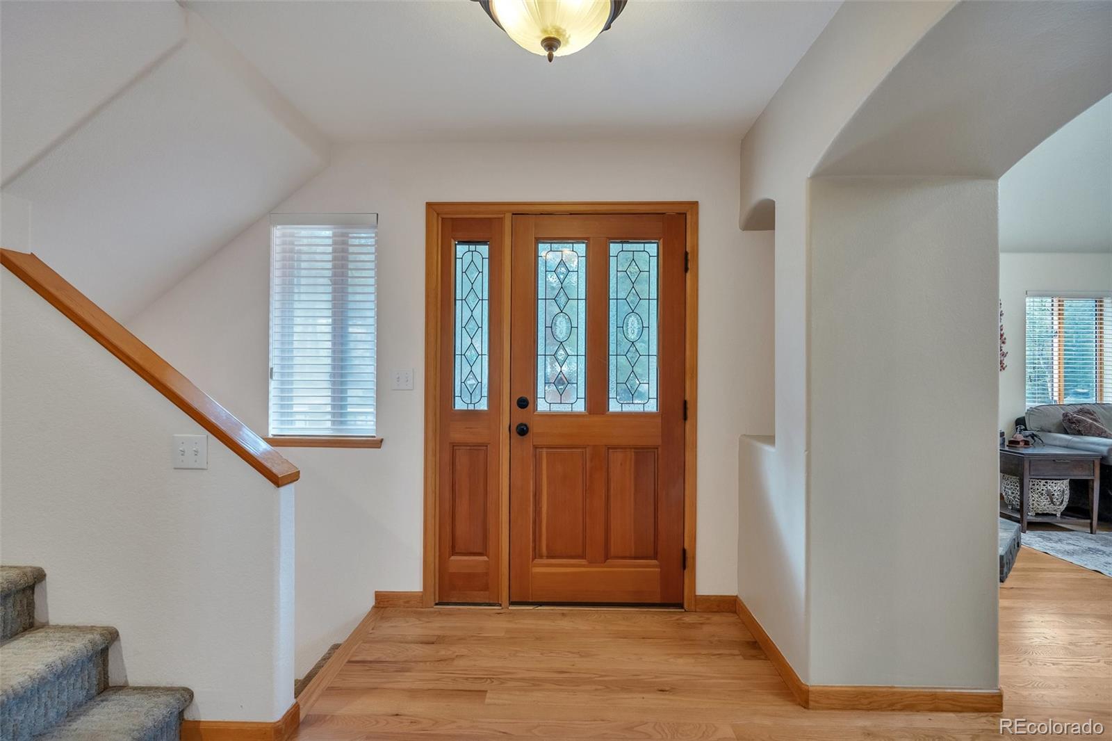 9590 South Warhawk Road Conifer, CO 80433 - Photo 3 of 43 a view of empty room with wooden floor and fan